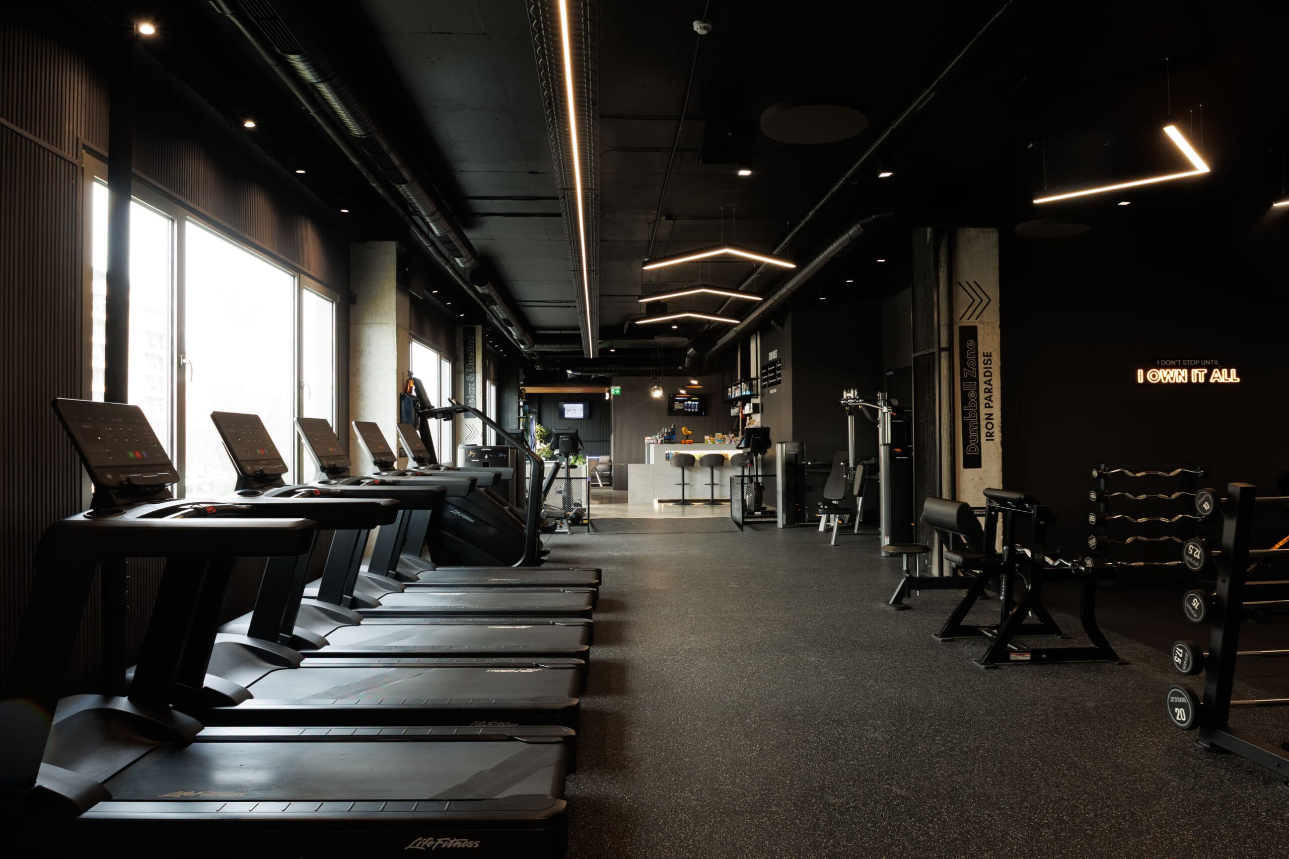 Cardio area with a row of Life Fitness treadmills